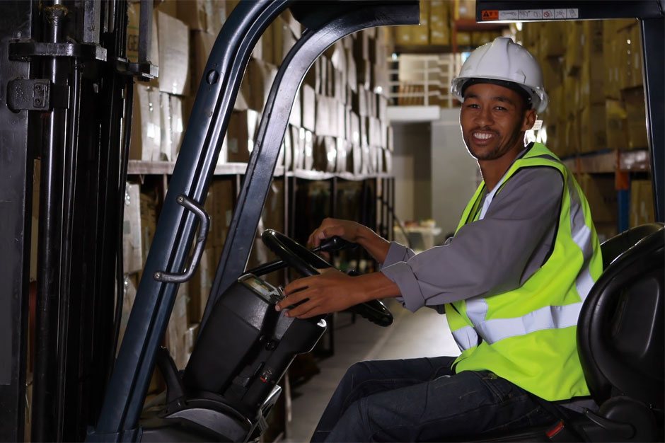 Forklift driver smiling at work